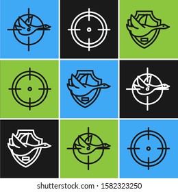 Set line Hunt on duck with crosshairs, Flying duck on shield and Target sport for shooting competition icon. Vector