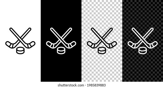 Set line Ice hockey sticks and puck icon isolated on black and white background. Game start.  Vector