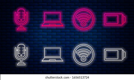 Set line Laptop, Wi-Fi wireless internet network, Microphone and Battery charge level indicator. Glowing neon icon on brick wall. Vector