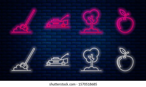Set line Lawn mower, Tree in the ground, Shovel in the ground and Apple. Glowing neon icon on brick wall. Vector