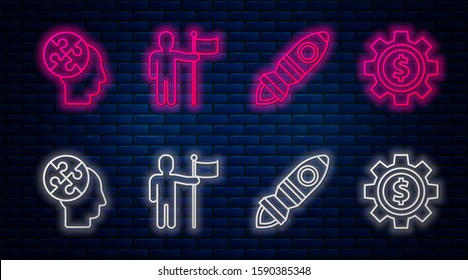 Set line Man holding flag, Rocket ship with fire, Human head puzzles strategy and Gear with dollar symbol. Glowing neon icon on brick wall. Vector