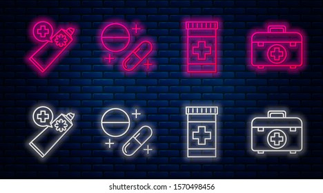 Set line Medicine pill or tablet, Medicine bottle, Ointment cream tube medicine and First aid kit. Glowing neon icon on brick wall. Vector