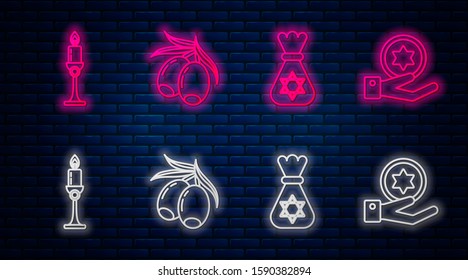 Set line Olives branch, Jewish money bag with star of david, Burning candle in candlestick and Jewish coin on hand. Glowing neon icon on brick wall. Vector