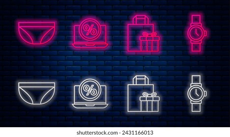 Set line Percent discount and laptop, Gift box, Underwear and Wrist watch. Glowing neon icon on brick wall. Vector