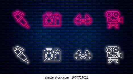 Set line Photo camera, Glasses, Fountain pen nib and Retro cinema. Glowing neon icon on brick wall. Vector