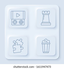 Set line Portable video game console, Chess symbol, Piece of puzzle and Popcorn in cardboard box. White square button. Vector