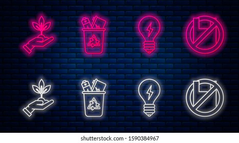 Set line Recycle bin with recycle symbol, Light bulb with lightning symbol, Plant in hand of environmental protection and Say no to plastic bags poster. Glowing neon icon on brick wall. Vector