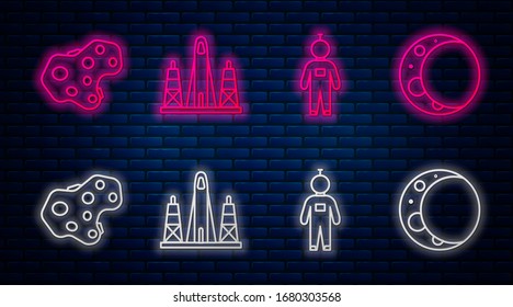 Set line Rocket launch from the spaceport, Astronaut, Asteroid and Moon. Glowing neon icon on brick wall. Vector