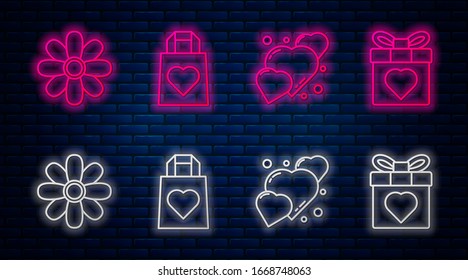 Set line Shopping bag with heart, Heart, Flower and Gift box and heart. Glowing neon icon on brick wall. Vector