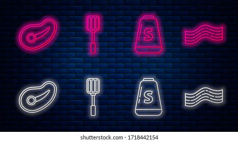 Set line Spatula, Salt, Steak meat and Bacon stripe. Glowing neon icon on brick wall. Vector