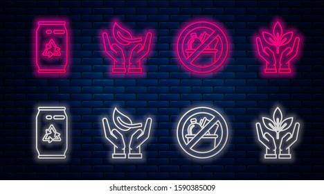Set line Sprout in hand of environmental protection, No trash, Can with recycle symbol and can and Plant in hand of environmental protection. Glowing neon icon on brick wall. Vector