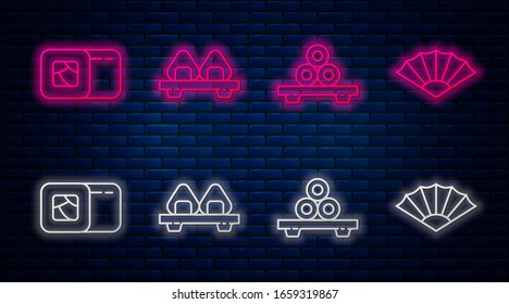 Set line Sushi on cutting board, Sushi on cutting board, Sushi and Paper chinese or japanese folding fan. Glowing neon icon on brick wall. Vector