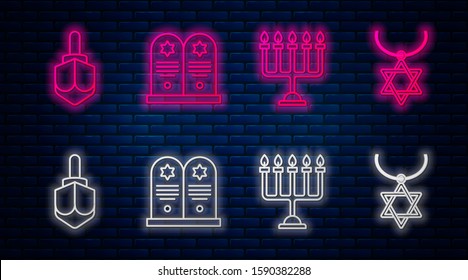 Set line Tombstone with star of david, Hanukkah menorah, Hanukkah dreidel and Star of David necklace on chain. Glowing neon icon on brick wall. Vector