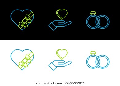 Set line Wedding rings, Candy heart shaped box and bow and Heart on hand icon. Vector
