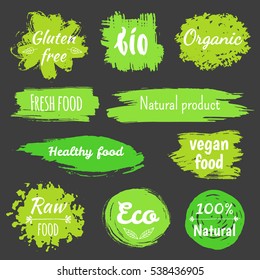 Set of logo templates with floral and grunge elements in green color for restaurant menu or food package. Fresh healthy organic vegan food logo labels and tags. Vector hand drawn illustration.