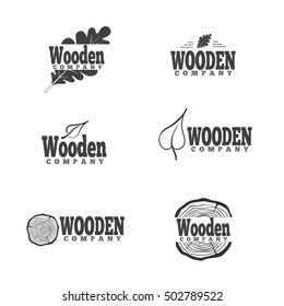 Set of logotypes made in vector. Woodwork and manufacture label templates. Emblems with timber industry elements. Logo for wooden company.