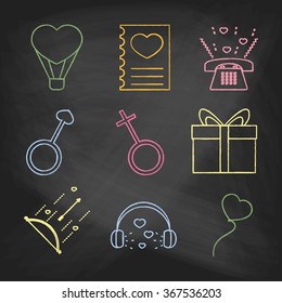 Set of love icons painted with colorful chalk on a blackboard. Decorative icons for Valentine's day. Hands-drawn style