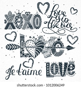 Set of love quotes. Hand drawn lettering. Happy Valentine's Day. Xoxo. Je t'aime. Freehand style. Doodle. Romantic holiday. Valentine card, postcard, banner, poster, print on clothes. Vector, eps10