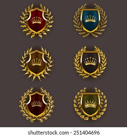 Set of luxury golden vector shields with laurel wreaths, crowns. Royal heraldic emblem, icons, label, badge, blazon for web, page design. Vector illustration EPS 10.