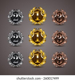 Set of luxury golden vector shields with laurel wreaths, ribbons. 1st, 2nd, 3rd places. Royal heraldic emblem, icons, label, badge, blazon for web, page design. Vector illustration EPS 10.