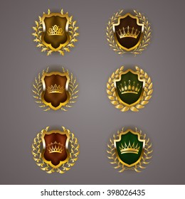 Set of luxury golden vector shields with laurel wreaths, crowns. Royal heraldic emblem, icons, label, badge, blazon for web, page design. Vector illustration EPS 10.