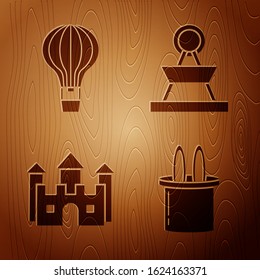 Set Magician hat and rabbit ears, Hot air balloon, Castle and Attraction carousel on wooden background. Vector