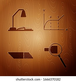 Set Magnifying glass, Workplace with table lamp and open book, Eraser or rubber and Pie chart infographic on wooden background. Vector