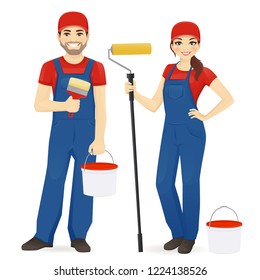 Set of male and female painters wearing blue overall with roller, brush and paint isolated vector illustration