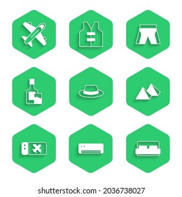 Set Man hat with ribbon, Air conditioner, Hotel room bed, Egypt pyramids, Airline ticket, Whiskey bottle and glass, Short or pants and Plane icon. Vector