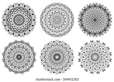 Set of mandalas. Ethnic oriental symbols. Symmetry round flower patterns. Black and white circle decorative elements in vector for design. 