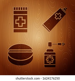 Set Medical bottle with nozzle spray, Medicine bottle, Medicine pill or tablet and Ointment cream tube medicine on wooden background. Vector