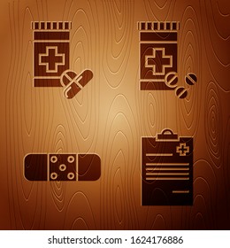 Set Medical clipboard with clinical record, Medicine bottle and pills, Bandage plaster and Medicine bottle and pills on wooden background. Vector