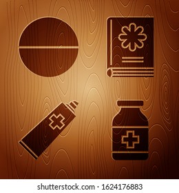 Set Medicine bottle, Medicine pill or tablet, Ointment cream tube medicine and Medical book on wooden background. Vector