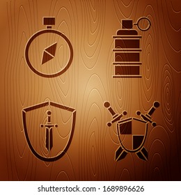 Set Medieval shield with crossed swords, Compass, Medieval shield with sword and Hand grenade on wooden background. Vector