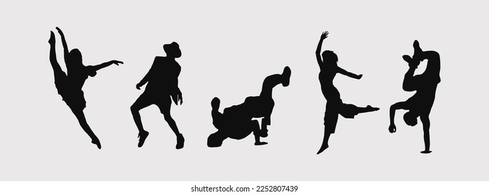 A set of men and women street dance hip hop dancers in silhouette