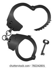 A set of metal handcuffs with a key