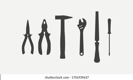 Set of metal tools, silhouettes isolated on white background. Pliers, adjustable wrench, screwdriver, hammer, file. Vector illustration.