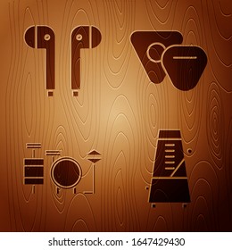 Set Metronome with pendulum in motion, Air headphones, Drums and Guitar pick on wooden background. Vector