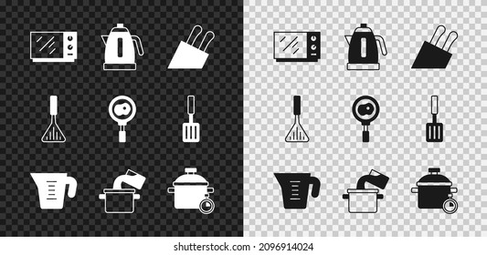 Set Microwave oven, Electric kettle, Knife, Measuring cup, Cooking pot, Barbecue spatula and Fried eggs on frying pan icon. Vector
