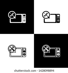 Set Microwave oven with screwdriver and wrench icon isolated on black and white background. Adjusting, service, setting, maintenance, repair, fixing.  Vector Illustration