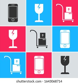 Set Mobile phone with app delivery tracking, Fragile broken glass symbol and Hand truck and boxes  icon. Vector