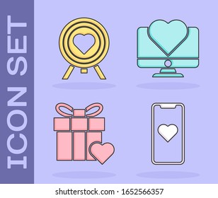 Set Mobile phone with heart, Heart in the center of darts target aim, Gift box and heart and Computer monitor with heart icon. Vector