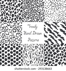 Set of modern trendy hand drawn seamless patterns. Wild animals nature textures.