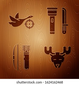 Set Moose head with horns, Hunt on duck with crosshairs, Bow and arrow in quiver and Flashlight and knife on wooden background. Vector