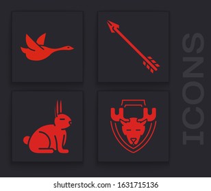Set Moose head on shield, Flying duck, Hipster arrow and Rabbit icon. Vector