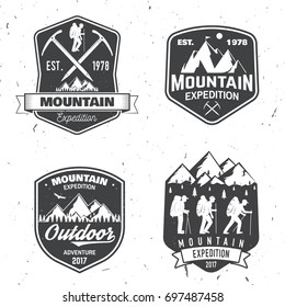 Set of mountain expedition badges. Vector illustration. Concept for shirt or logo, print, stamp or tee. Vintage typography design with mountaineers and mountain silhouette. Outdoors adventure emblems.
