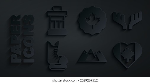 Set Mountains, Deer antlers, Skates, Heart shaped Canada flag, Canadian maple leaf and Inukshuk icon. Vector