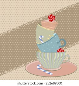a set of mugs with sweets for tea