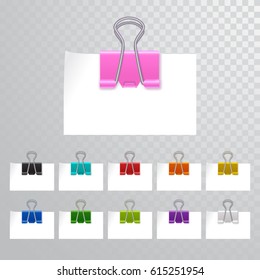 Set of multicolored binder clips on a piece of paper on a transparent background. Clerical clothespin on a transparent background