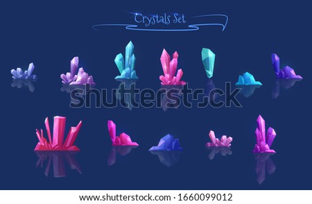 A set of multi-colored crystals, stones for ice and cave locations in the game design. Magic crystals, mineral rocky crystallization on a dark background.